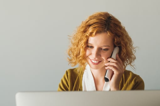 Businesswoman Speaking On The Phone At The Office Businesswoman Speaking On The Phone At The Office